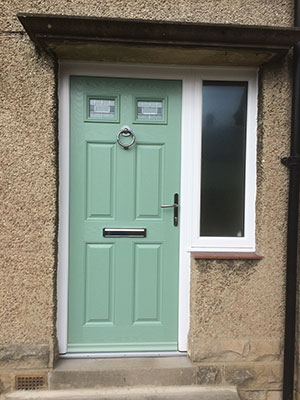 Green composite front door with glazed side panel
